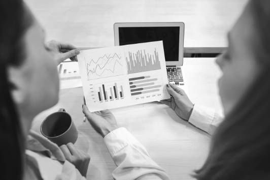 two-women-entrepreneurs-working-together-office_b&w